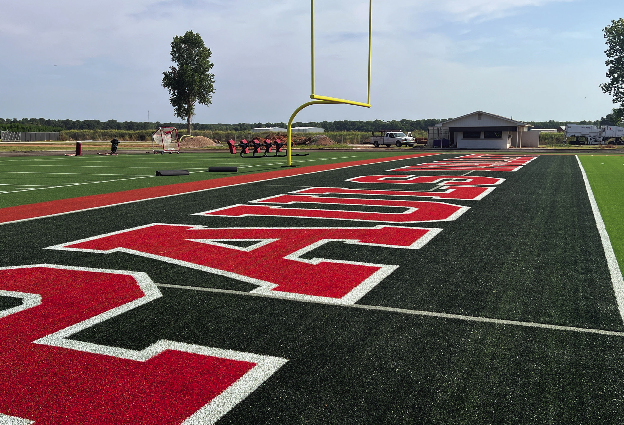 Pauls Valley‘s Thompson Field will welcome the 2026 football season with several upgrades including new artificial turf (top), a new video scoreboard (lower center), and new restrooms (lower right). Over the summer, the school district also began sanding and refinishing the floor in the basketball gym at the high school (lower left). News Star photos by Suzanne Mackey