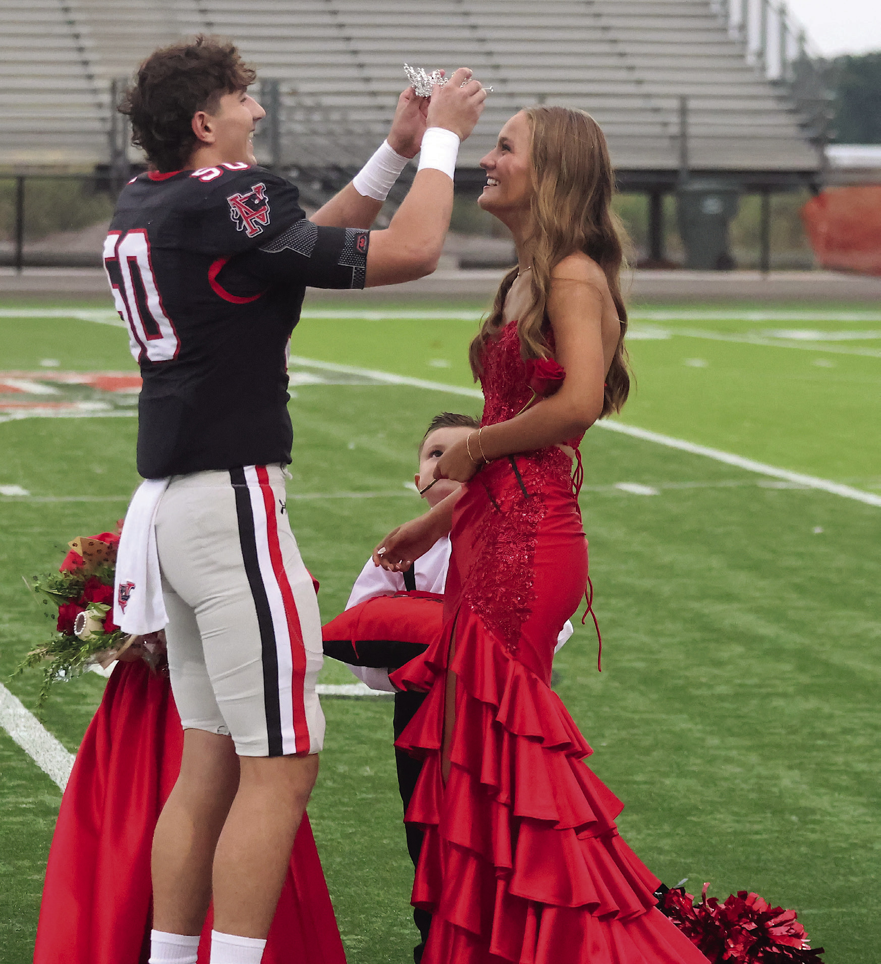 Pauls Valley Homecoming King Avery Cates crowns Kate Taylor Homecoming Queen before Friday’s game against Madill. Photo by Mike Arie
