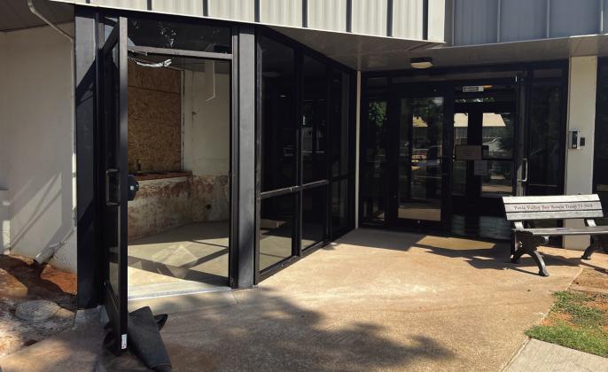 Crews were still finishing up a new controlled-access entry foyer at the high school last week. The vestibule includes a service window to allow visitors to interact with office staff without needing to enter the building. All four school sites will have similar controlled-access entry areas this year. School Superintendent Brett Knight said the old entry doors (to the right of this photo) will be removed and replaced with solid windows. News Star photo by Suzanne Mackey