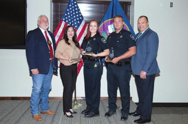 Pictured from left to right are Charlie Mackey, Oklahoma Sheriffs and Peace Officers Association; Meredeth Kueck, who accepted award on behalf of Michael Brown; Officer Sara Miller; Officer Kyler Truett; and Lighthorse Chief of Police Michael Manning.