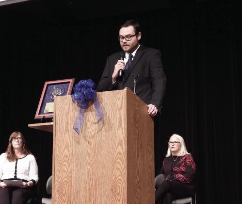 Pauls Valley Junior High teacher Nolan Pullen took the podium to speak about the National Blue Ribbon Award program during Monday’s celebration. Pullen traveled to Washington, D.C. earlier this month with Principal Martha Graham (back right) and Librarian Melinda Alfred (back left) to accept the National Blue Ribbon Award on behalf of Pauls Valley Junior High School.