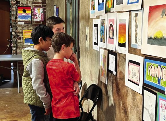 Whitebead students take in the art work on display during the Garvin County Student Art Show at the Pauls Valley Arts Council Building Friday. News Star photo by Suzanne Mackey