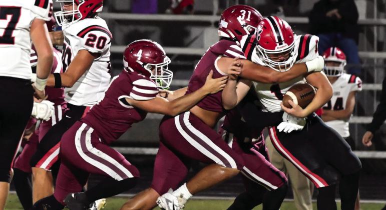 Stratford’s #1 Joseph Smith is wrapped up by Wynnewood’s # 4 Deagan Dixon, # 31 Coalten Kennedy and #28 Jayson Potts. News Star photos by Don Coffey