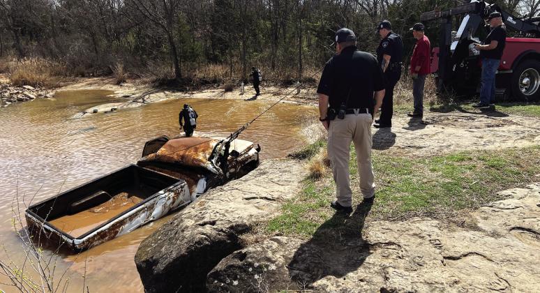 The Pauls Valley Police Department, Chickasaw Lighthorse Police dive team and a local wrecker service worked March 13 to recover a pickup truck found submerged in the Pauls Valley City Lake. For more photos visit gcnewsstar.com. News Star photo by Suzanne Mackey