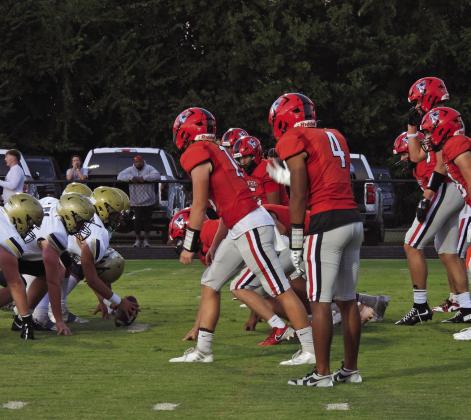 The Pauls Valley defense prepares for the ball snap in the Panthers’ fourth-quarter win over Kingfisher 43-40. News star photo by Chris Mackey