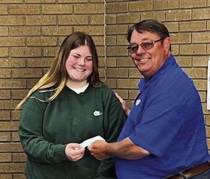 Pauls Valley Rotary Speech Contest Chair Bill McAngus presents Milo Jones with a prize check after she won second place in the organization's Four-Way Test Speech Contest April 15. Courtesy photo