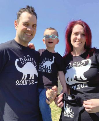 Chris Figueroa with his wife, Krysta, and their son.
