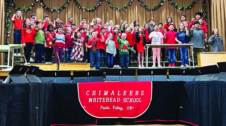 Whitebead third and fourth grade students sing a selection of Christmas tunes for staff, students and family members during Whitebead’s Christmas program Dec. 14.