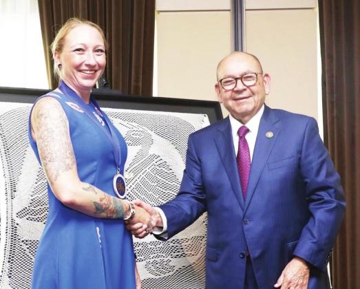 Chickasaw Nation Governor Bill Anoatubby presents Chickasaw artist Tyra Shackleford “Best of Show” honors for the 2022 Artesian Arts Festival, June 25, in downtown Sulphur, Oklahoma.
