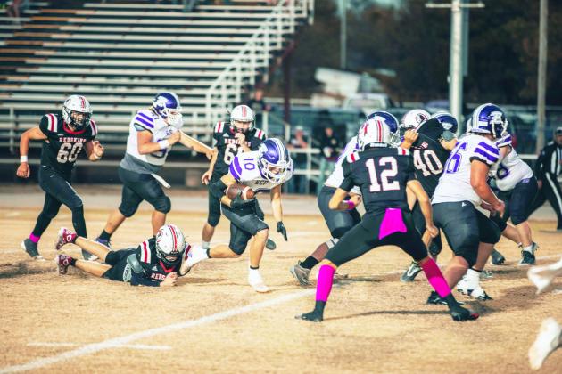 Elmore City-Pernell’s Dawson Milligan tries to find the defensive hole against Rush Springs last week. The Badgers went on to win 20-8. Photo courtesy of Jake Faucett