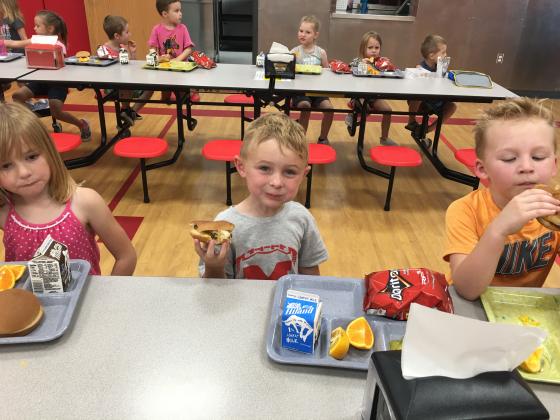 Paxton Lemieux and friends are enjoying hamburgers served in the Maysville school cafeteria with beef that is all natural, grain fed and contracted by the district from a local supplier. Courtesy photo. 