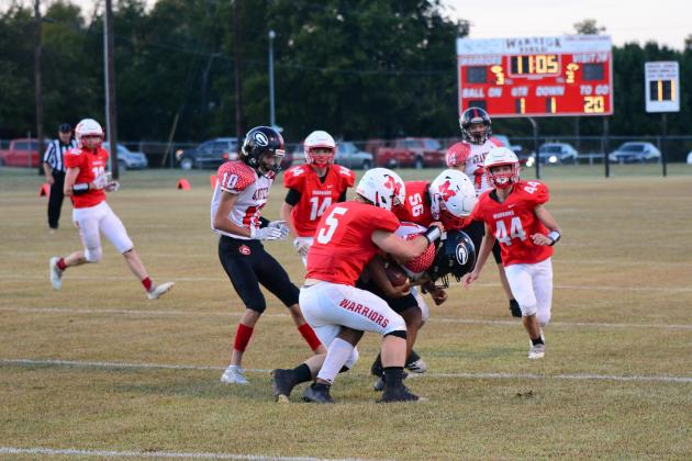 Nigel Reid and Kolby Wyatt gang tackle the Grandfield running back. Photo by Denny Park