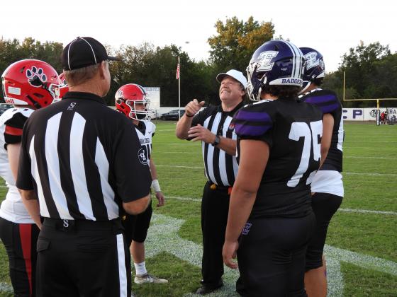 Referee tosses the coin.