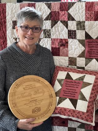 Garvin County's OHCE members and OSU Cooperative Extension staff presented Nanette Shultz with mementos to commemorate her years of service during Sunday's reception to celebrate her retirement. 