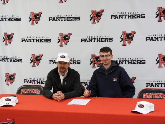 Pauls Valley High School senior Lane Bell signed a letter of intent with Murray State College's Livestock Judging Team on Friday. Bell (right) is pictured with Murray State Livestock Judging Coach Blaine Red (left).