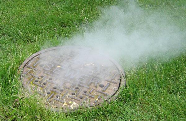 Smoke coming from sewer cover during smoke test