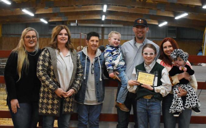 Bristol Wood received the 2022 Give It Your All award in memory of Dale and Toby Jones at the Maysville Livestock Show held Feb. 18. Pictured, left to right, are Maysville Ag Instructor Brittany Morphew, Brenda Jones, Judy Jones, Chipper Jones, Justin Jones, Bristol Wood, Jaycie Jones and Paxxley Jones. Courtesy photo
