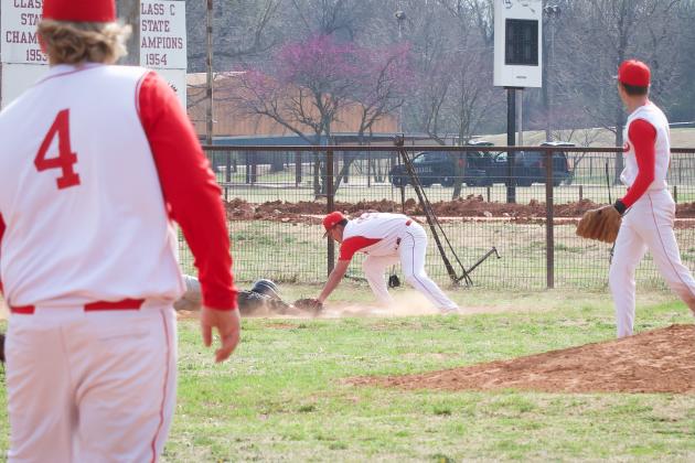 Maysville's #15 Seth Hillis tags the runner out. Maysville went on to win the game 12-5