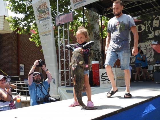Kennedy Dalton, age 5, weighed in an 18.46-pound catfish at Saturday's Okie Noodling Tournament. This was Kennedy's first year at the tournament, but her dad, Jesse, has been a tournament participant for several years. The Daltons are from Lawton. 