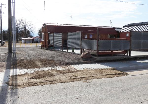 The town of Maysville has agreed to remove a section of new curbing that is blocking the graveled drive-thru at Toodles Tacos. The curb was installed in November as part of a sidewalk project along Main Street. In return for removing the curb, the town has asked the business to remove part of the metal fencing at the end of the drive-thru to improve visibility. News Star Photo by Chris Mackey.