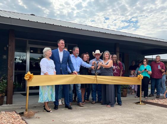 Governor Kevin Stitt was in Stratford Wednesday to attend a ribbon cutting for the 99+1 Stratford House. The facility will provide a safe and stable home for young women aging out of Oklahoma's foster care system and at-risk women, children and widows. Stitt is pictured with  Mike and Gail Priest of the 99+1 Foundation and volunteers and residents of the 99+1 House. 