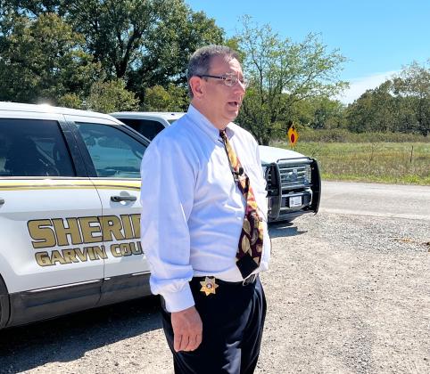 Garvin County Sheriff Jim Mullett speaks to reporters Tuesday afternoon after a body believed to be fugitive Kameron Jenkins was found near Ruppe Road in Garvin County.