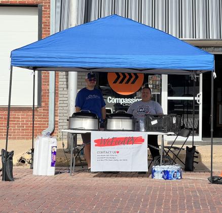 Volunteers with We Feed PV, led by Zac Davis (left), set up to feed those in the community who are hungry on a recent Saturday morning. 