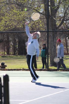 Bill Delaplain serves the ball to his opponent during Saturday's Community Tennis Tournament at Wacker Park. Photo by Michelle Daves