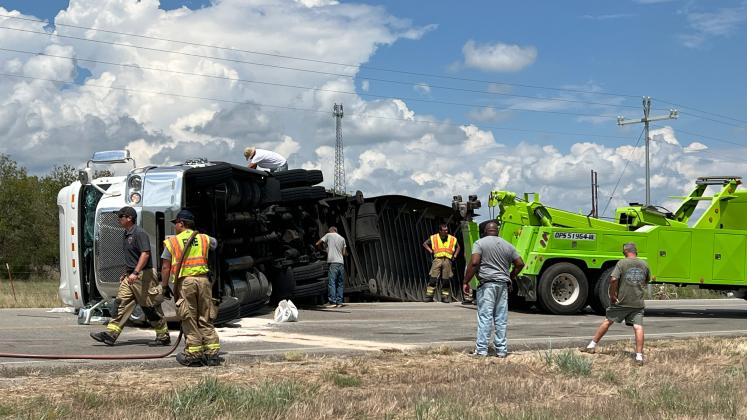Emergency crews worked to clear an overturned semitrailer on Highway 19 east of Pauls Valley Friday afternoon. News Star photo by Suzanne Mackey