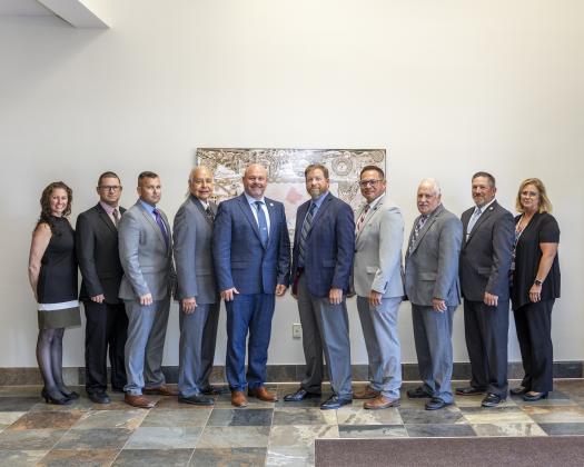 The Oklahoma State Bureau of Investigation recognized nine current and former Chickasaw Nation Emergency Management team members with Red Feather Awards for their “above-and-beyond” effort throughout the investigation into Faith Lindsey’s 2019 disappearance. Pictured, from left: Sara Billings, JP Maples, Brandon Burchfield, Steve Dunn, Steve Cash, OSBI Investigative Division Director John Jones, George Jesse, Dewayne Price, Adam Kuhlman and Carol Williamson. Courtesy photo.