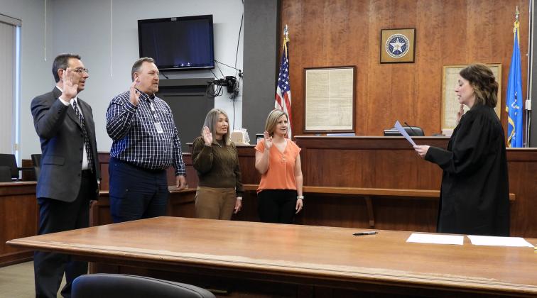 Garvin County Sheriff Jim Mullett, District 2 County Commissioner Tom Pyle, County Clerk Lori Fulks and Court Clerk Laura Lee were all sworn in by District Judge Leah Edwards Monday as they began new terms of office.