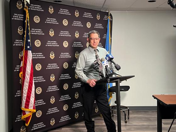 Garvin County Sheriff Jim Mullett speaks to reporters Monday about the investigation of a double homicide at a marijuana farm near Wynnewood. News Star photo by Suzanne Mackey
