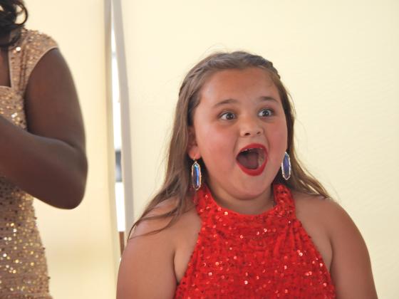 Peach Princess candidate Issabella Rivera reacts as her younger sister Joslyn Rivera is named 2025 Peach Blossom during Saturday's Stratford Peach Festival. A few minutes later, Issabella was named 2025 Peach Princess. News Star photo by Chris Mackey