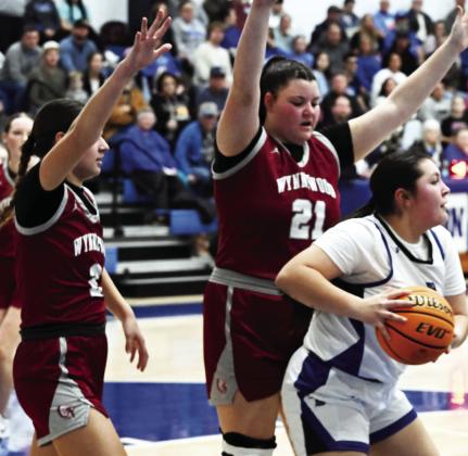 Wynnewood's #2 Larissa Lopez and #21 Trinity Dotson get their hands up on defense against a Dickson player during the Lady Savages' 44-39 overtime loss at Dickson.