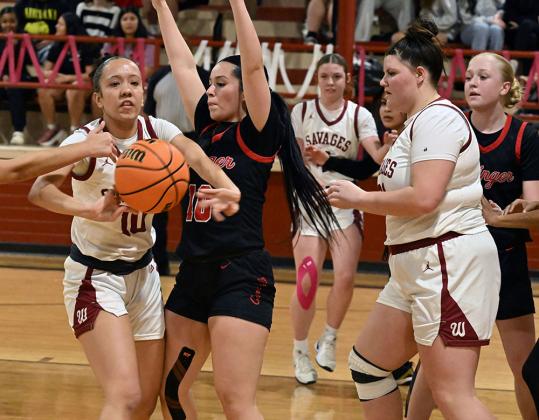Wynnewood's Journee Jones passes the ball against Springer. Photo by Don Coffey