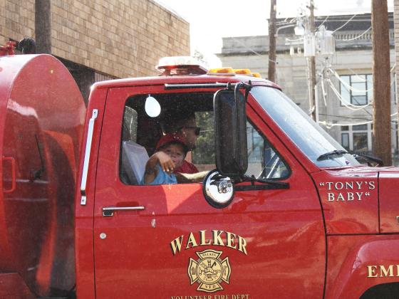 Walker Fire Department assisted in Monday's parade with water spray and balloons. News Star Photo by Chris Mackey.
