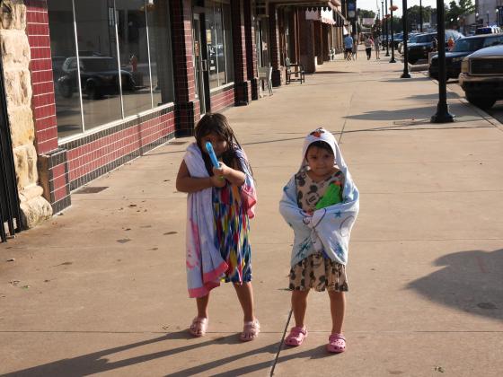 Two area youngsters wind down and dry off after Monday's parade. News Star photo by Chris Mackey