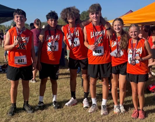 Lindsay cross country runners show off their medals from the Blanchard Burner Meet on Saturday. Courtesy photo