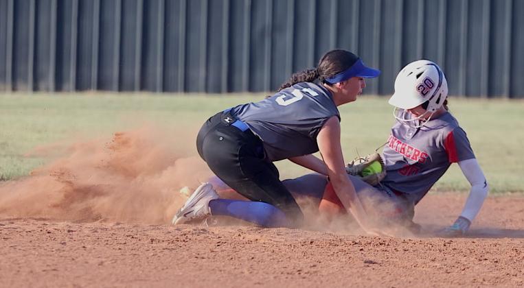 In a cloud of dust, Pauls Valley's Raegan Close slides in safely at second during a sixth inning rally during Thursday's 4-1 win over St. Mary. Photo by Mike Arie.