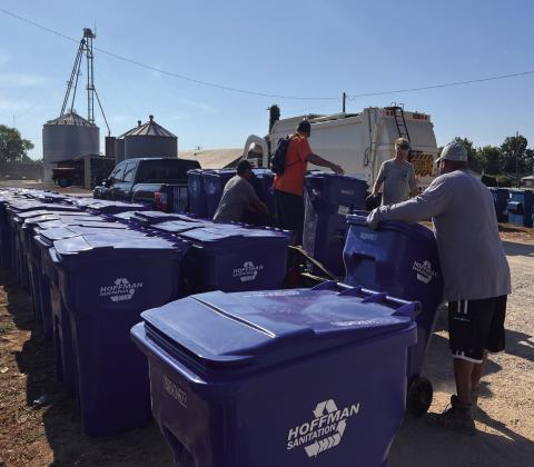 Crews with Hoffman Sanitation worked to distribute polycarts to residential addresses across Maysville Saturday morning. News Star photo by Suzanne Mackey