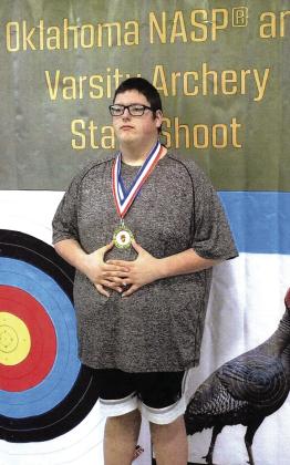 Paoli’s Chase Sumner poses with his first place medal at the Western Division state archery tournament. Courtesy Photo