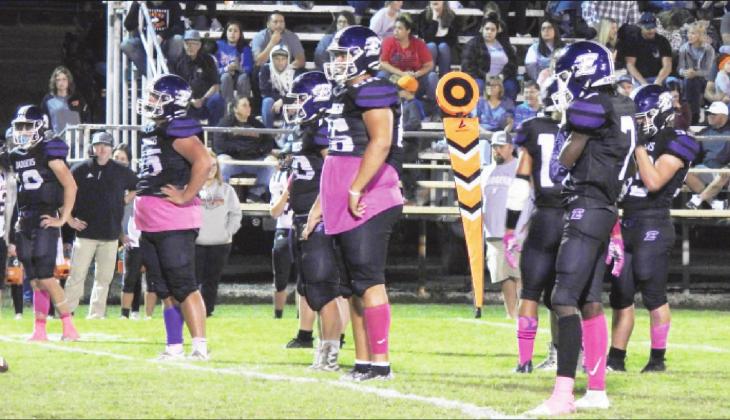 The Badgers' defense taking a moment before the Wayne Bulldogs' offense gets lined up.