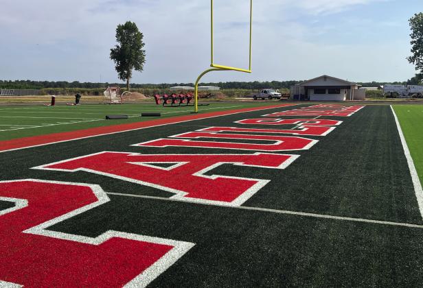 Pauls Valley‘s Thompson Field will welcome the 2026 football season with several upgrades including new artificial turf (top), a new video scoreboard (lower center), and new restrooms (lower right). Over the summer, the school district also began sanding and refinishing the floor in the basketball gym at the high school (lower left). News Star photos by Suzanne Mackey