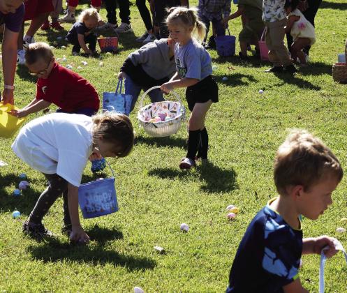 Children scramble to gather Easter Eggs during Pauls Valley’s Egg Hunt at Wacker Park Saturday. News Star photo by Chris Mackey