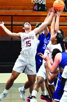 Wynnewood's Jake Everett (#15) and Brylan Williams (#21) fight for the rebound against Healdton in the Rush Springs Black Diamond Classic Tournament. News Star photo by Don Coffey
