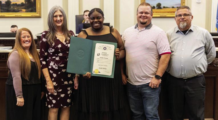 Rep. Cynthia Roe with Annika Pittman, her parents and coach. Courtesy photo