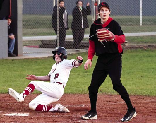 Wynnewood’s Cole Beasley slides into third base in the Savages’ dominating win 24-1 over Springer March 1. The Savages beat Maud 14-3 Monday. Tuesday the Savages pulled a double header with wins over Wewoka 16-1 and Wayne 7-2 for an undefeated season opening week. News Star photo by Don Coffey