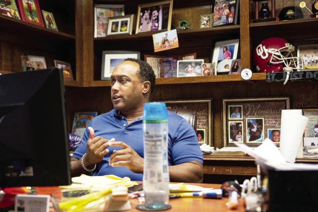 Lawton resident and former OU football player Larry Bush ran as a Democrat for House of Representatives in 2016, 2018 and 2020 losing all three times to a Republican opponent. The logo of his insurance business is the same as his former campaign. (Whitney Bryen/Oklahoma Watch)