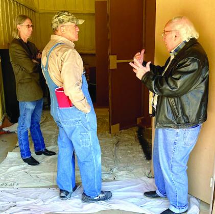 Artist Kevin Stark, engineer Gary Koch and Garvin County Choral Society and Sinfonietta artistic director Jack Bowman confer about the set design for the upcoming presentation of "Amahl and the Night Visitors" to be held Dec.10 at 7 p.m. at the First Presbyterian Church in Pauls Valley. Courtesy Photo