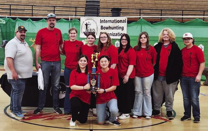 The Maysville archery team competed in the 2024 Oklahoma State NASP/IBO 3D Challenge tournament in McLoud March 2, where they placed third out of eight teams shooting in the high school division. From left: NASP/IBO official, team coach Bradley Uhles, Madison Hunter, Racy Wigley, Addison Welch, Karissa Hammond, Mya Darnell, Mason Darnell and David Steakley. Kneeling in front are Samantha Landeros and Marissa Moates. Courtesy photo
